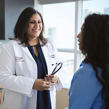 A doctor talking to a patient