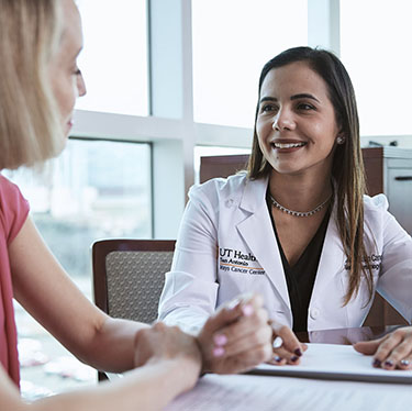 A doctor speaking with a patient