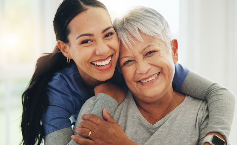 Smiling patient and their cancer provider
