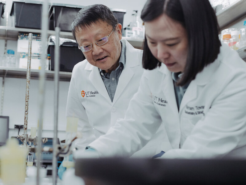 two scientists work in a research lab.