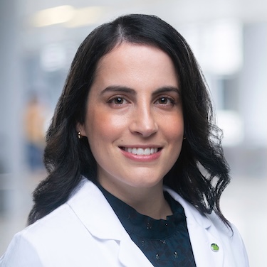 Dr. Bojanini wearing her white coat