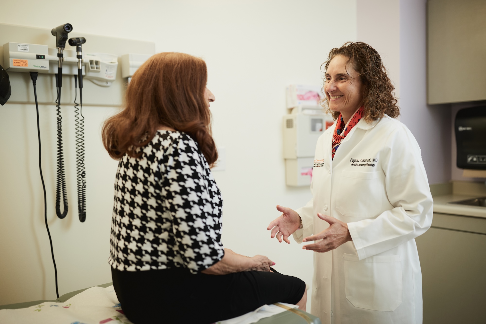Dr. Kaklamani speaking to a patient