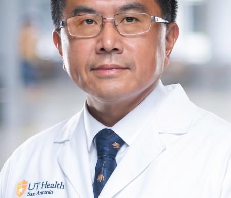 Dr. Zheng in a white coat