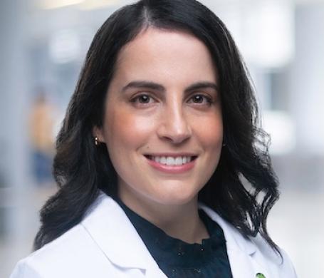 Dr. Bojanini wearing her white coat